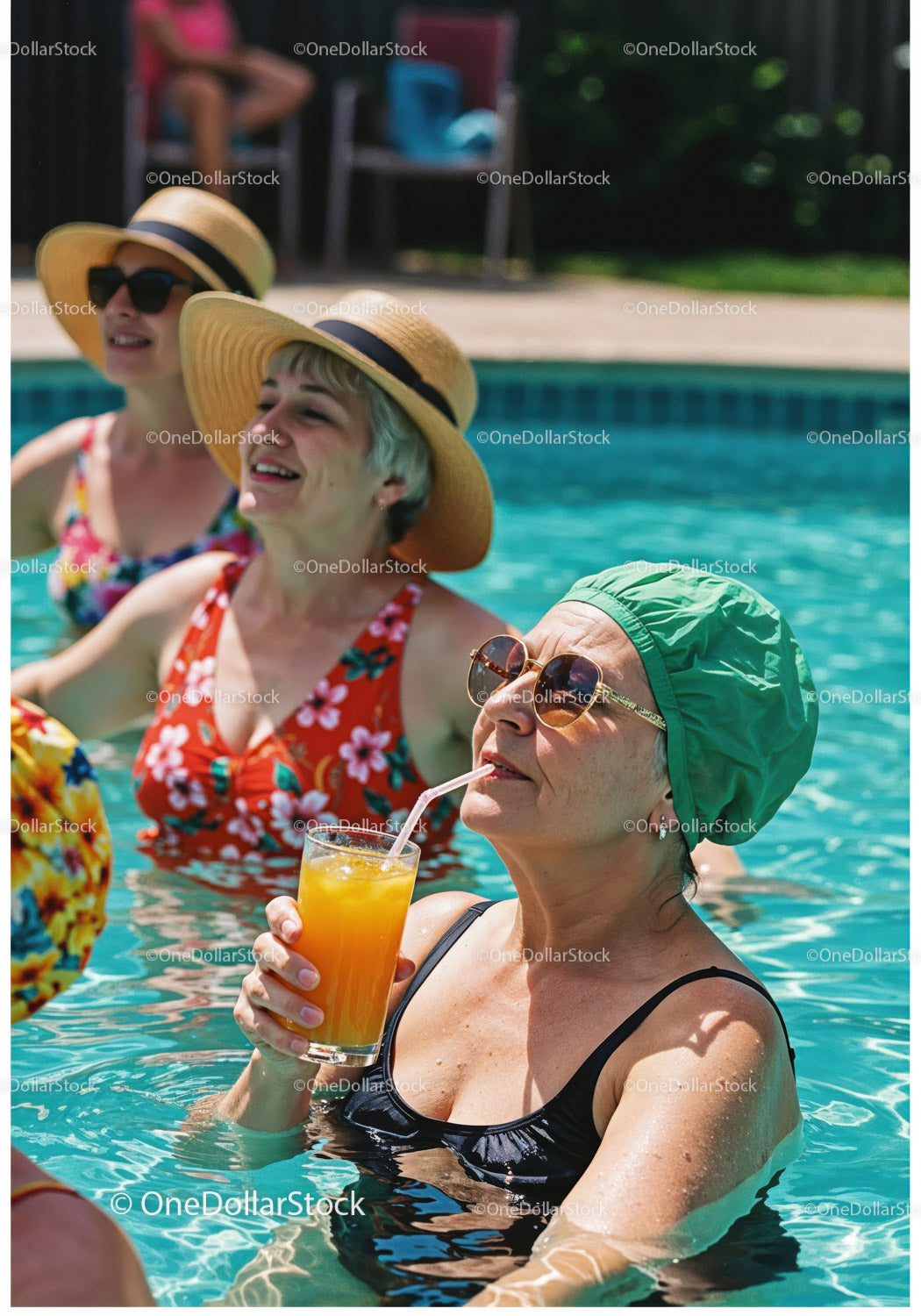 Elderly Women Relaxing and Drinking Refreshing Drinks in Pool