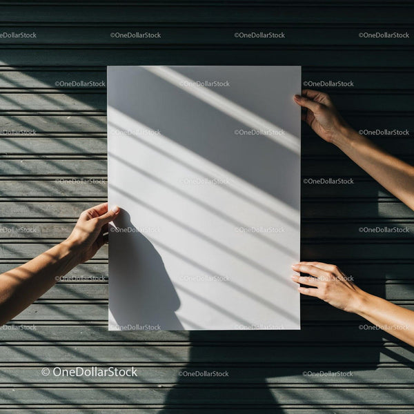 Hands holding blank white poster with striped shadows JPG Mockup Image
