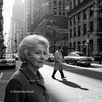 Elegant Senior Woman Walking Through Busy City Street in Black and White
