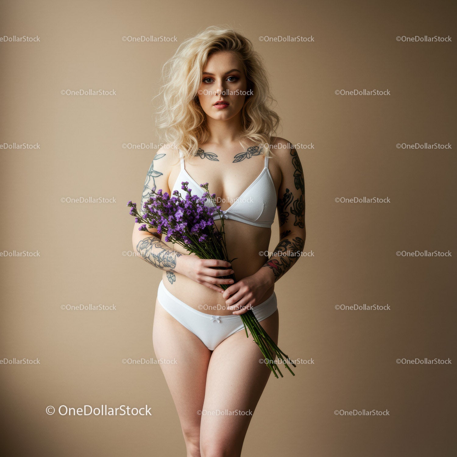 Beautiful Woman with Blonde Hair Holding Purple Flowers in White Lingerie