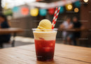 Refreshing Strawberry Ice Cream Sundae in Plastic Cup with Striped Straws