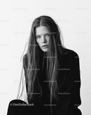 Monochrome Portrait of a Young Woman with Wet Hair and Intense Expression