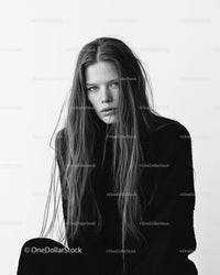 Monochrome Portrait of a Young Woman with Wet Hair and Intense Expression