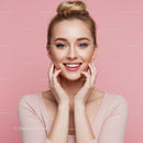 Young Woman Smiling Portrait with Pink Background and Blonde Hair