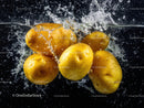 Fresh Ripe Yellow Apples in Water Splash