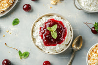 Delicious Whipped Cream Dessert with Cherry Topping and Mint