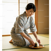 Woman in traditional kimono placing Japanese rice ball