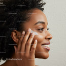 Beautiful Woman Applying Eye Cream in Natural Skincare Routine