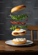 Deconstructed bagel sandwich with egg and arugula floating