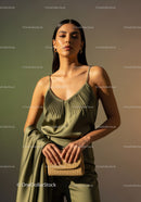 Elegant Woman in Silk Camisole with Gold Earrings and Chic Style