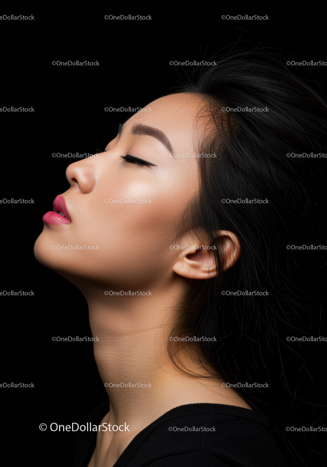 Serene young woman with closed eyes and flowing hair