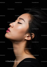Serene young woman with closed eyes and flowing hair