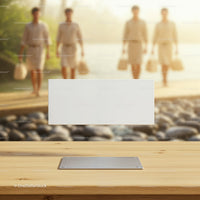 Blank white card on wooden table by riverside path