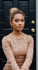 Pensive young woman in lace dress by dark door