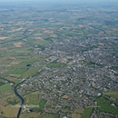 Aerial View of a Modern City with River and Green Spaces