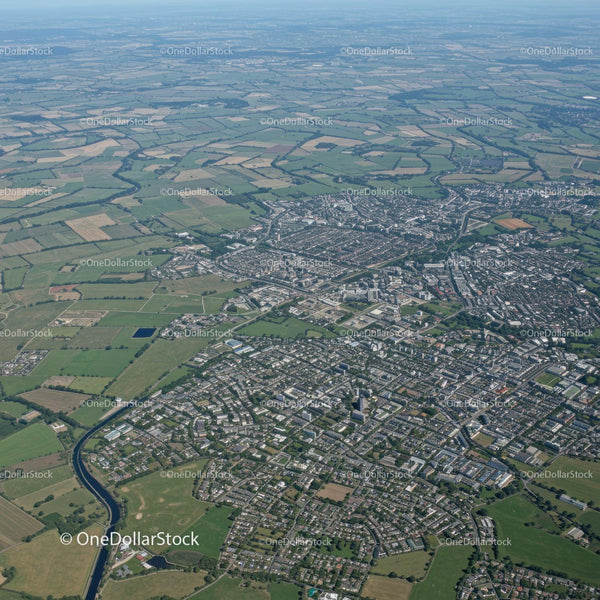 Aerial View of a Modern City with River and Green Spaces