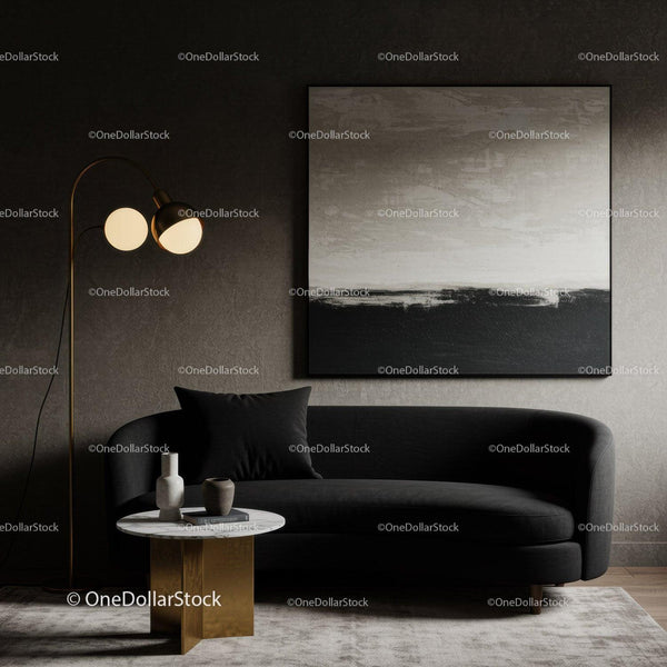 Modern living room with black sofa and abstract art