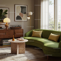 Cozy living room with green curved sofa and natural light
