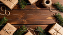 Rustic Christmas gifts with pine branches on wooden table