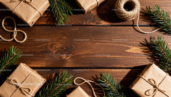 Rustic Christmas gifts with pine branches on wooden table