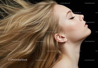 Blonde woman with flowing hair in profile view