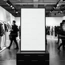 Blank advertising poster in modern clothing store interior