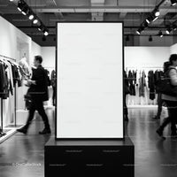 Blank advertising poster in modern clothing store interior