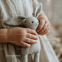 Toddler Holding Soft Gray Linen Bunny Toy