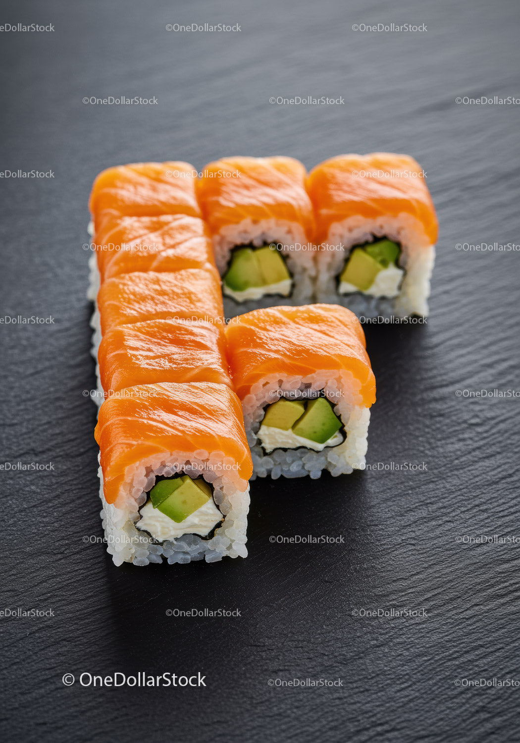 Fresh sushi rolls with salmon and avocado slices