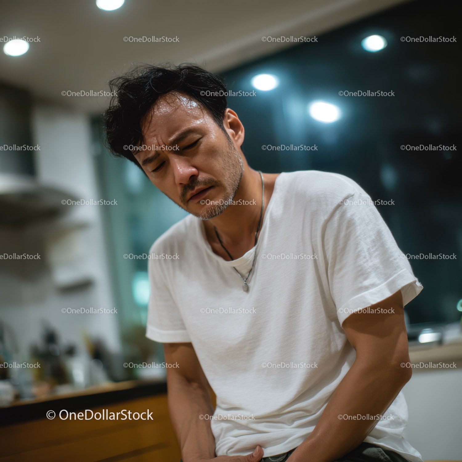 Concerned Man Experiencing Stomach Pain in Modern Indoor Setting