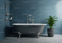 Classic clawfoot bathtub with potted palm in blue bathroom