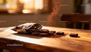 Chocolate cookies spilling cocoa powder on wooden table