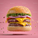 Juicy Cheeseburger with Melty Cheese and Fresh Vegetables on Pink Background