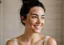 Portrait of a Smiling Young Woman with Acne Scars and Clear Skin