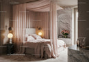 Elegant canopy bed with soft pink drapes and ambient lighting