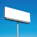 Large blank billboard against clear blue sky