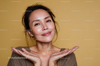 Smiling Woman Touching Face with Joyful Expression in Portrait
