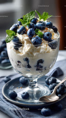 Creamy Blueberry Dessert in Glass Bowl with Fresh Mint Garnish