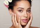 Close-Up of a Beautiful Woman with Freckles and Floral Hair Accessories