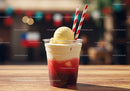 Refreshing Strawberry Ice Cream Sundae in Plastic Cup with Striped Straws