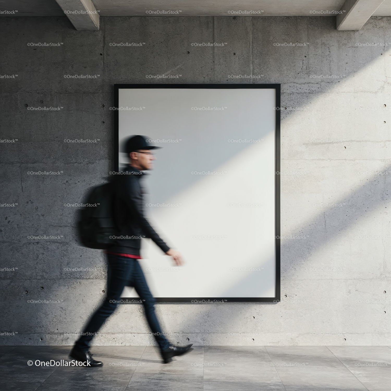 Blurred pedestrian walking past blank gallery wall