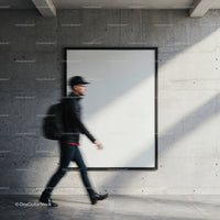 Blurred pedestrian walking past blank gallery wall