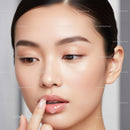 Elegant Woman with Glossy Lips and Flawless Skin