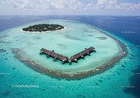 Overwater Bungalows on Tropical Island with Turquoise Clear Water