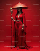 Elegant Woman in Red Dress with Accessories Against Red Background