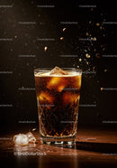 Refreshing iced coffee with coffee beans in motion