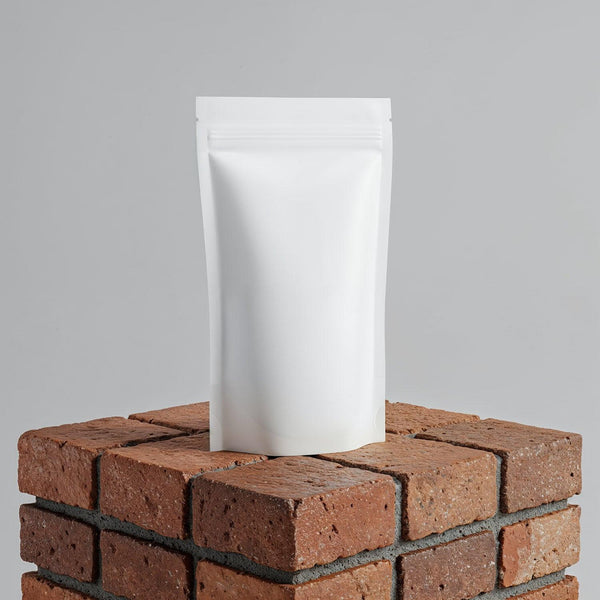 Minimalist White Pouch on Rustic Brick Surface JPG Mockup Image