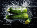 Fresh Green Zucchini Vegetables Floating in Water with Splash Effect