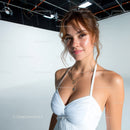 Young Woman in White Dress with Layered Necklaces Smiling Portrait