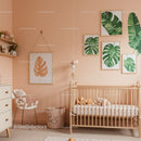 Minimalist Nursery with Green Monstera Leaf Wall Art and Pastel Pink Walls